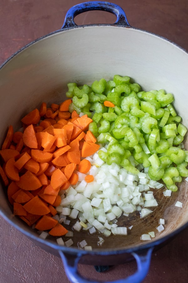 Cooking vegetables for white bean soup.