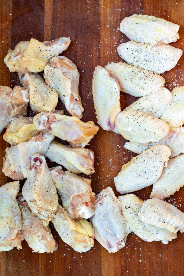 Seasoning and separating the chicken wings.