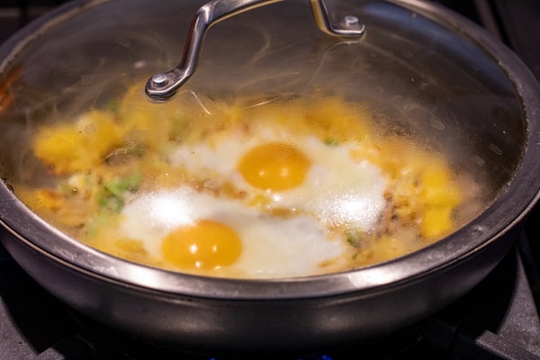 Steamed eggs in spaghetti squash breakfast skillet.