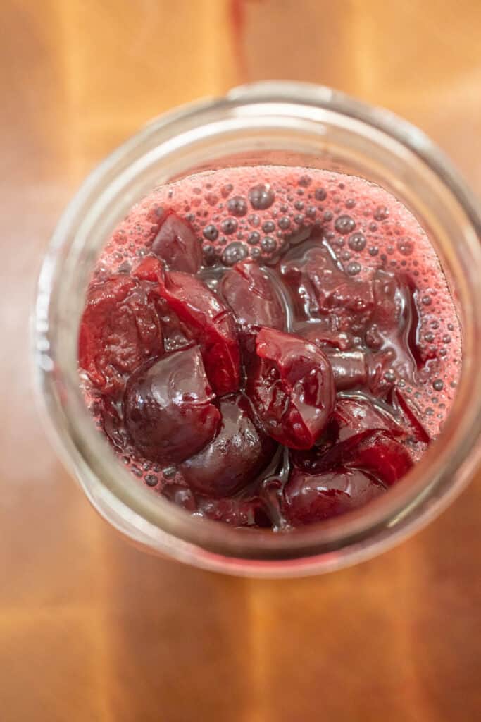 Cherry compote done in a jar.
