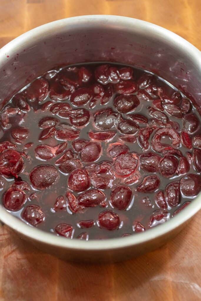 Making cherry compote with fresh cherries.