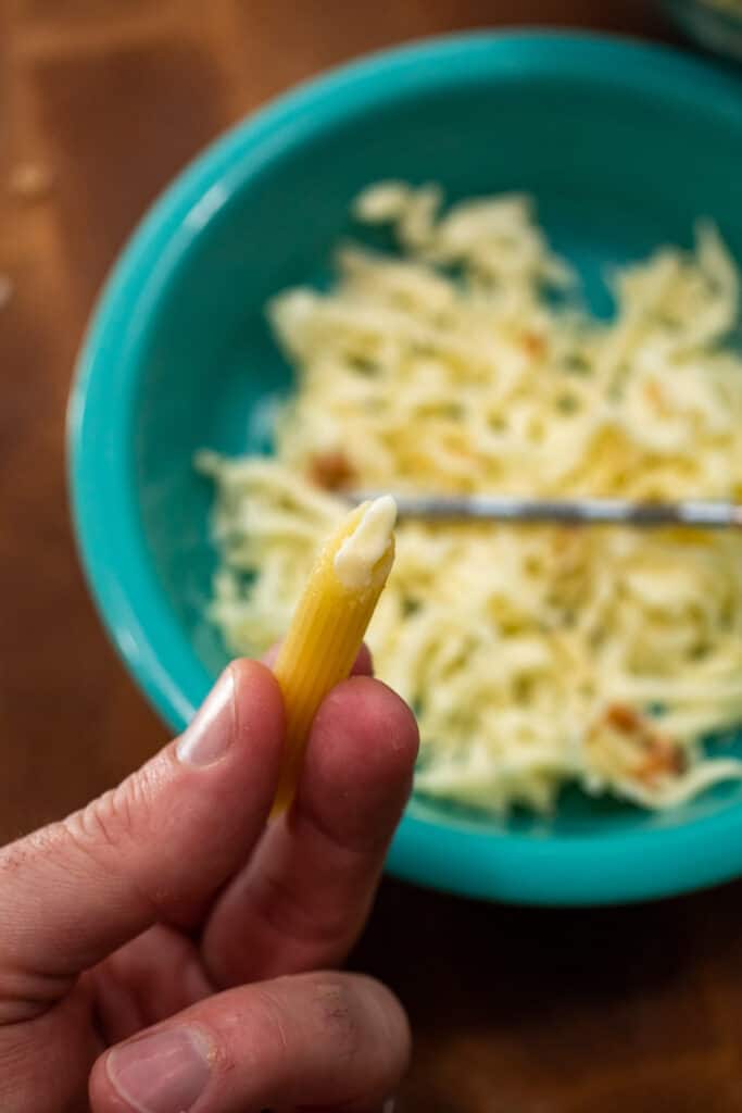 Adding cheese to pasta