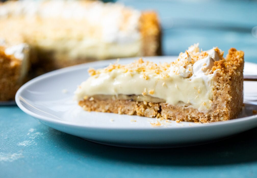 This epic banana coconut cream pie has layers of banana on a cookie crust. The filling is a rich coconut cream pudding and it's topped with toasted coconut! macheesmo.com