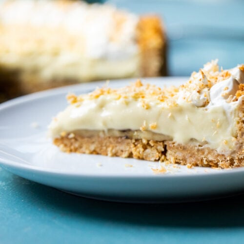 This epic banana coconut cream pie has layers of banana on a cookie crust. The filling is a rich coconut cream pudding and it's topped with toasted coconut! macheesmo.com