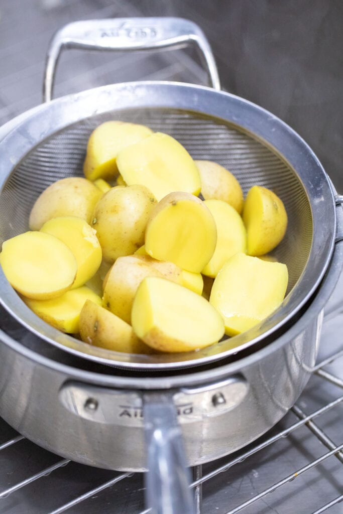 Boiled potatoes ready to roast.