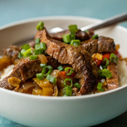 This slow cooker pepper steak is about as easy as dinner can get. Toss the ingredients in your cooker and come back to a delicious dinner!