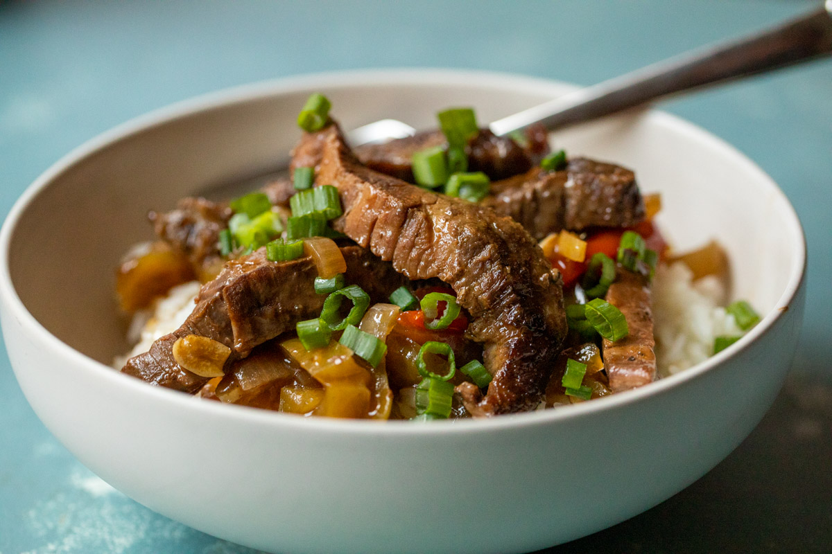 This slow cooker pepper steak is about as easy as dinner can get. Toss the ingredients in your cooker and come back to a delicious dinner!