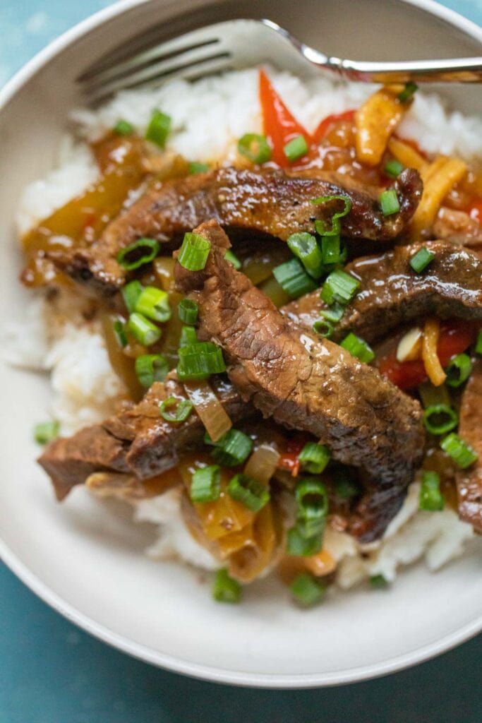 This slow cooker pepper steak is about as easy as dinner can get. Toss the ingredients in your cooker and come back to a delicious dinner! 