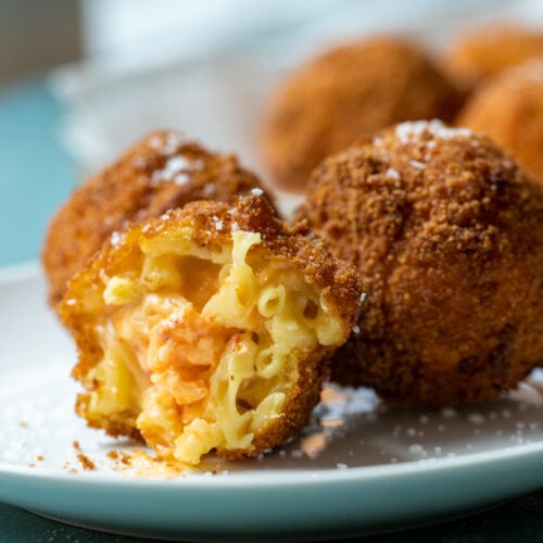 Homemade macaroni and cheese stuffed with pimento cheese and rolled into balls.  Bread and fry the balls and these Macaroni Cheese Bites will be a hit at any party!  macheesmo.com #macandcheese #pimentocheese