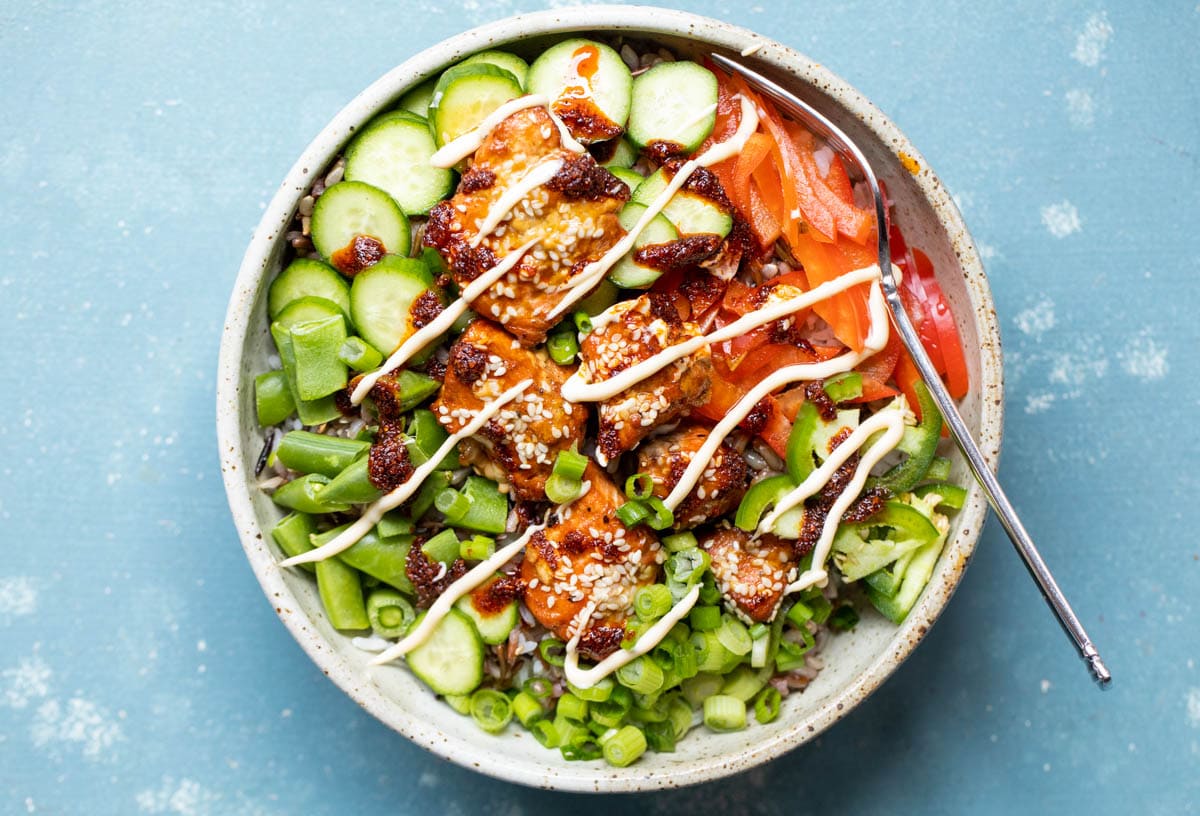 Spicy Salmon Bowls with toppings.l