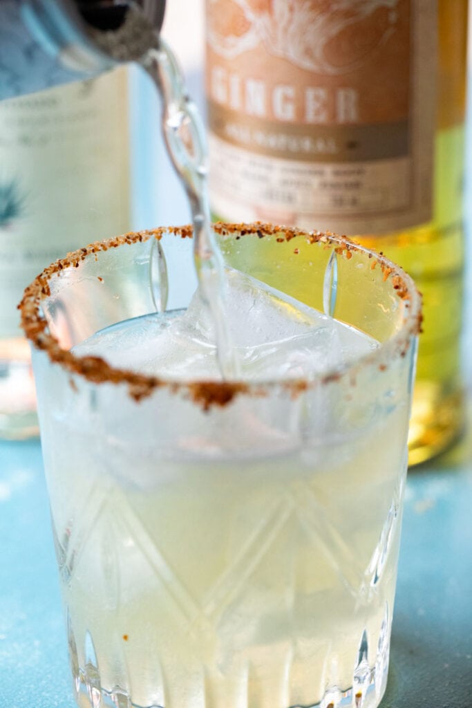 Topping margarita with ginger beer.
