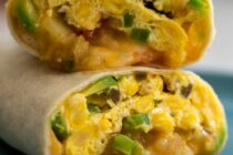 This microwave breakfast burrito is not just delicious, but also ready in 10 minutes and includes green chile potatoes, eggs, veggies, and cheese!