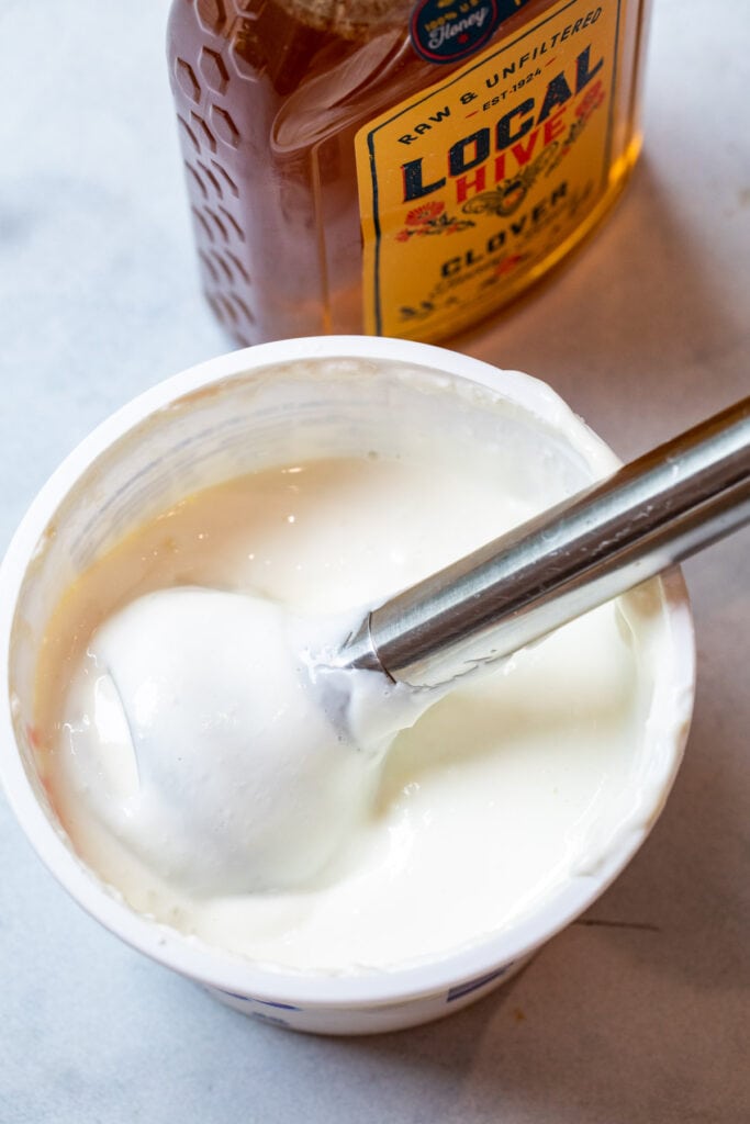 Whipping cottage cheese with an immersion blender.