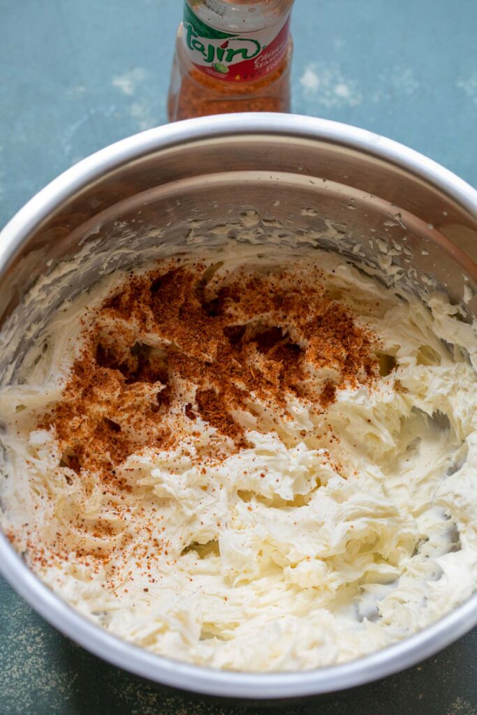 Whipping cream cheese with spices.