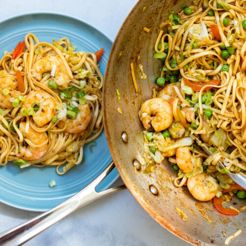 Shrimp Lo Mein on a plate and in wok.